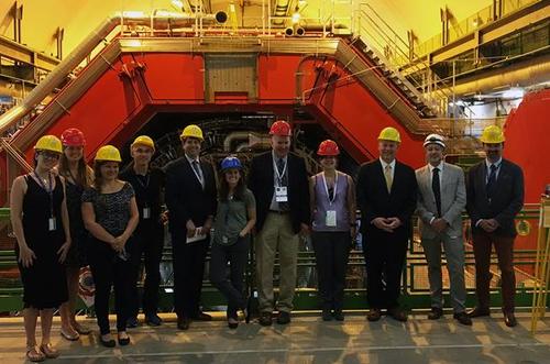 group of people in front of ALICE detector