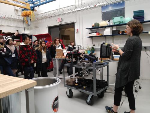 professor talking to students in lab