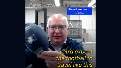 Screenshot of video clip with person holding football and captions.