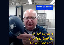Screenshot of video clip with person holding football and captions.