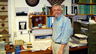 Peter Parker at his desk at WNSL