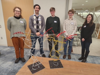 5 people posing for photo at visualize science event
