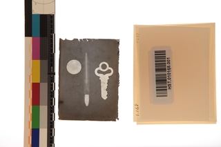 X-ray plate. Key-coin. Glass. Contact paper reversal of original glass plate.