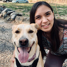 headshot of person with dog.