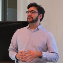 headshot of scientist presenting