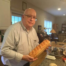 person holding bread.