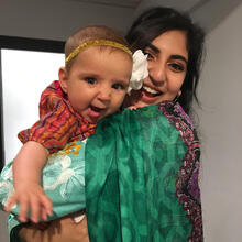 Scientist holding baby.