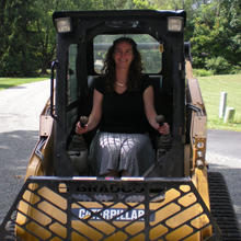 Person driving front loader