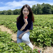 person sitting in field.