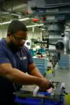 person working in machine shop